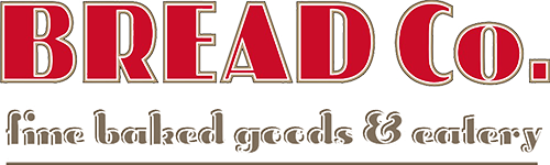 Bread Co. logo featuring bold red lettering and a brown background, representing The Bread Company, a client of KWD Marketing, known for its breakfast, lunch, and catering services.